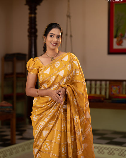 Semi chanderi saree yellow and off white with allover zari checks & batik prints and batik printed border