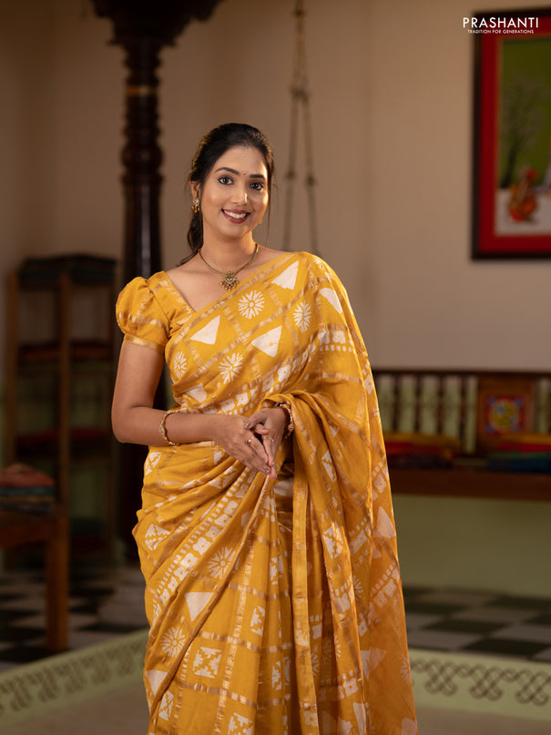 Semi chanderi saree yellow and off white with allover zari checks & batik prints and batik printed border