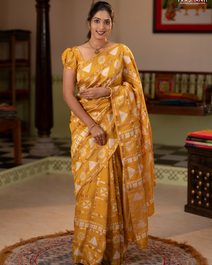 Semi chanderi saree yellow and off white with allover zari checks & batik prints and batik printed border
