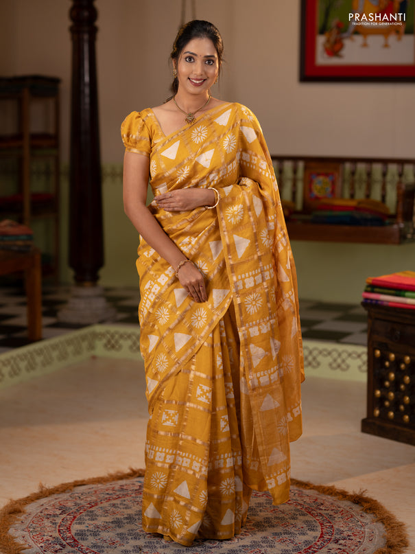 Semi chanderi saree yellow and off white with allover zari checks & batik prints and batik printed border