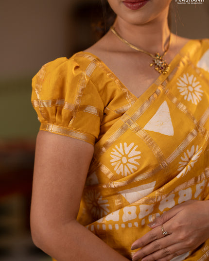 Semi chanderi saree yellow and off white with allover zari checks & batik prints and batik printed border