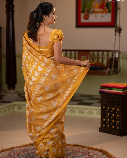 Semi chanderi saree yellow and off white with allover zari checks & batik prints and batik printed border