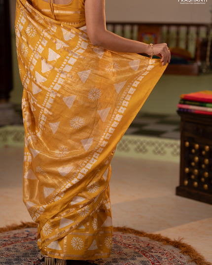 Semi chanderi saree yellow and off white with allover zari checks & batik prints and batik printed border