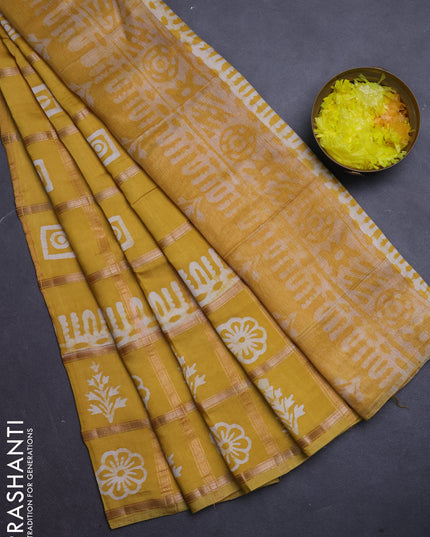 Semi chanderi saree yellow and off white with allover zari checks & batik prints and batik printed border