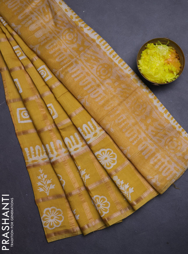 Semi chanderi saree yellow and off white with allover zari checks & batik prints and batik printed border