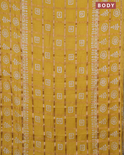 Semi chanderi saree yellow and off white with allover zari checks & batik prints and batik printed border