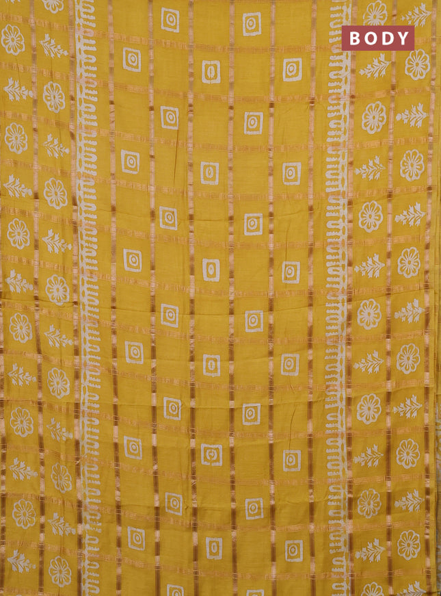 Semi chanderi saree yellow and off white with allover zari checks & batik prints and batik printed border