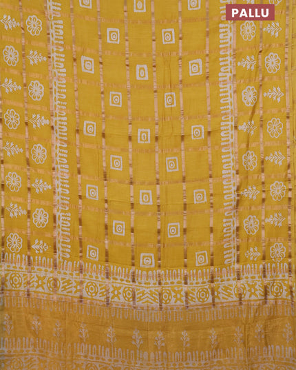 Semi chanderi saree yellow and off white with allover zari checks & batik prints and batik printed border