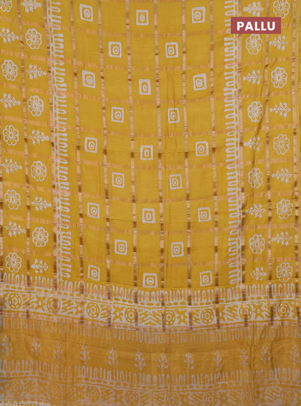 Semi chanderi saree yellow and off white with allover zari checks & batik prints and batik printed border
