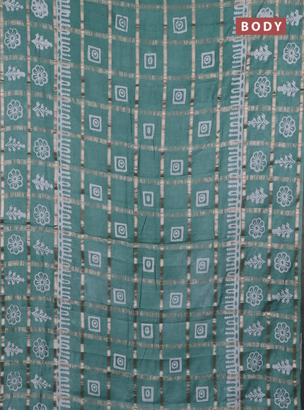 Semi chanderi saree mild teal green and off white with allover zari checks & batik prints and batik printed border