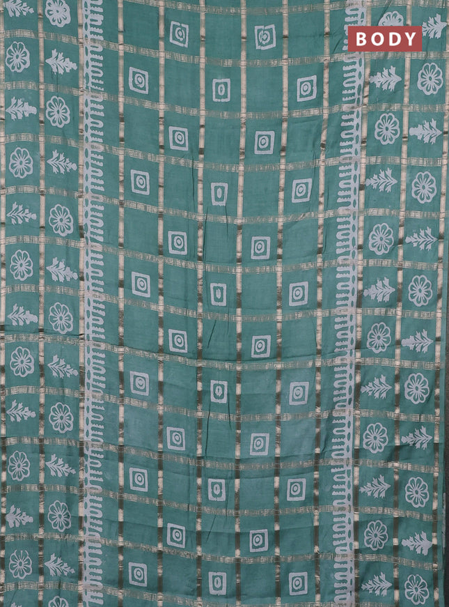 Semi chanderi saree mild teal green and off white with allover zari checks & batik prints and batik printed border