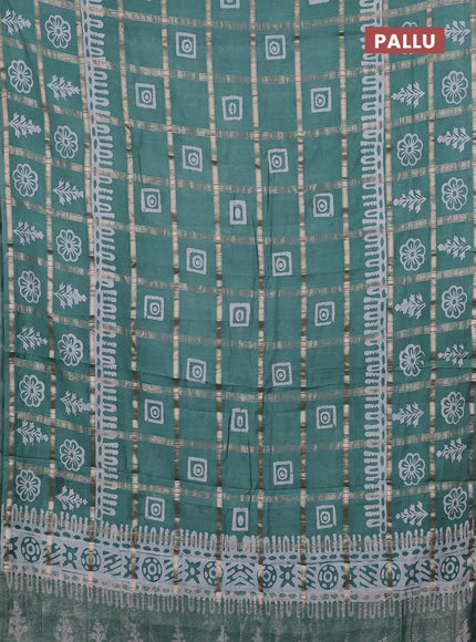 Semi chanderi saree mild teal green and off white with allover zari checks & batik prints and batik printed border