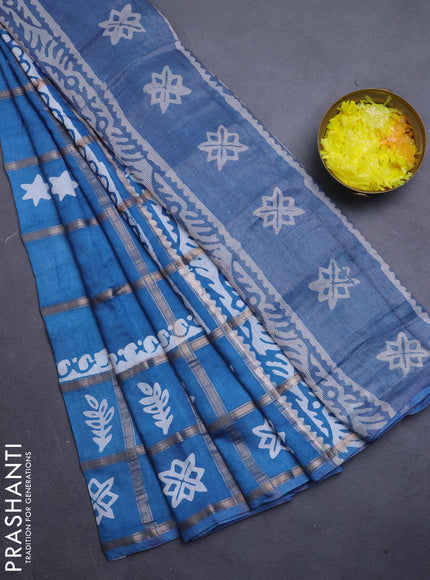 Semi chanderi saree teal blue with allover zari checks & batik prints in borderless style