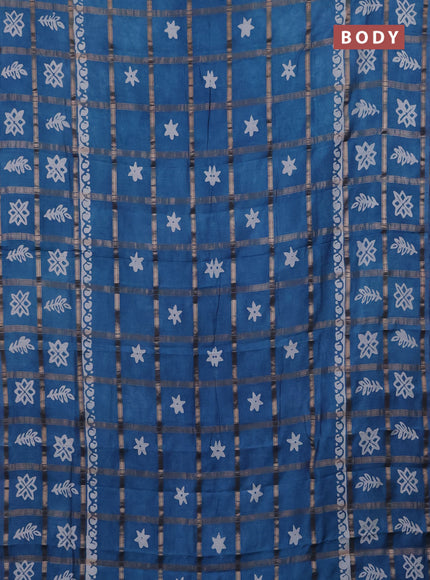 Semi chanderi saree teal blue with allover zari checks & batik prints in borderless style