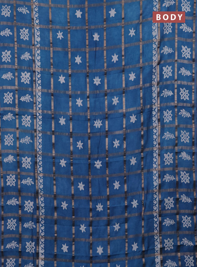 Semi chanderi saree teal blue with allover zari checks & batik prints in borderless style