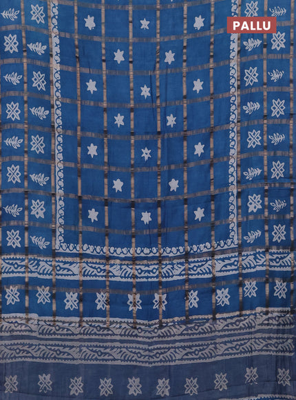 Semi chanderi saree teal blue with allover zari checks & batik prints in borderless style