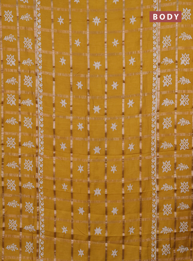 Semi chanderi saree mustard yellow with allover zari checks & batik prints in borderless style