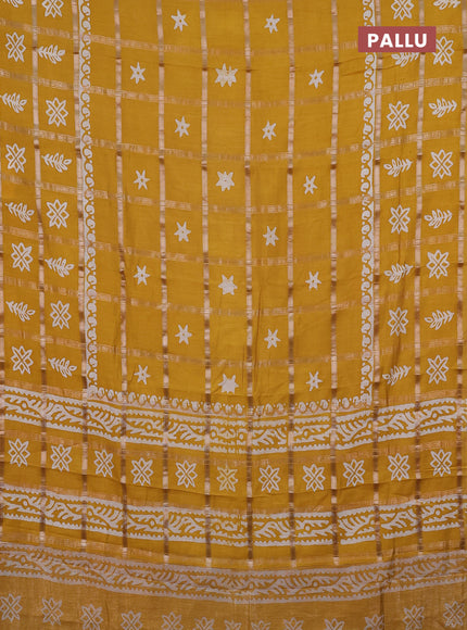 Semi chanderi saree mustard yellow with allover zari checks & batik prints in borderless style