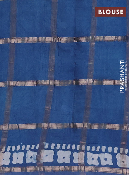 Semi chanderi saree teal blue with allover zari checks & batik prints in borderless style