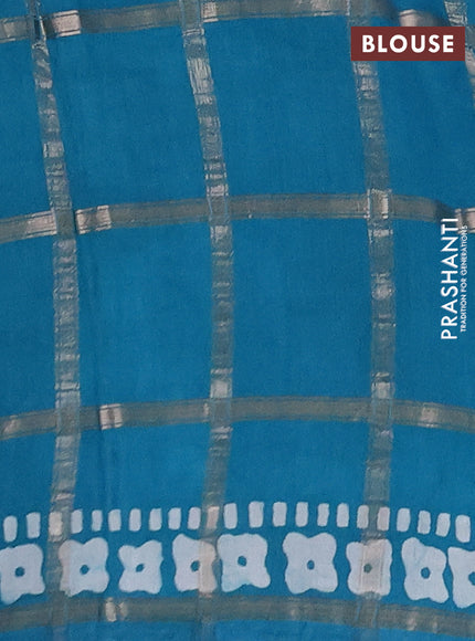Semi chanderi saree teal green with allover zari checks & batik prints in borderless style