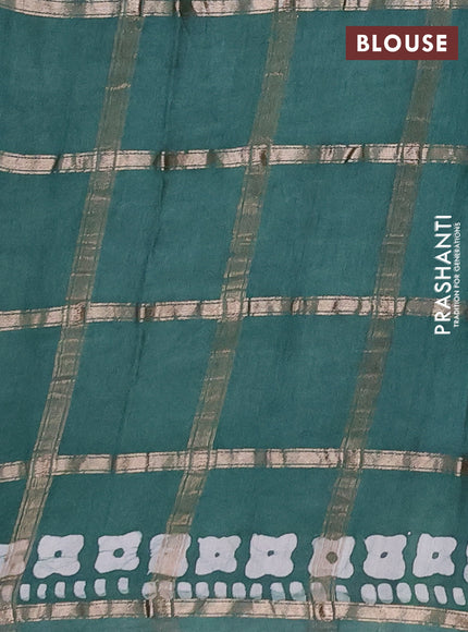 Semi chanderi saree green with allover zari checks & batik prints in borderless style