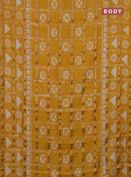 Semi chanderi saree mustard yellow with allover zari checks & batik prints in borderless style