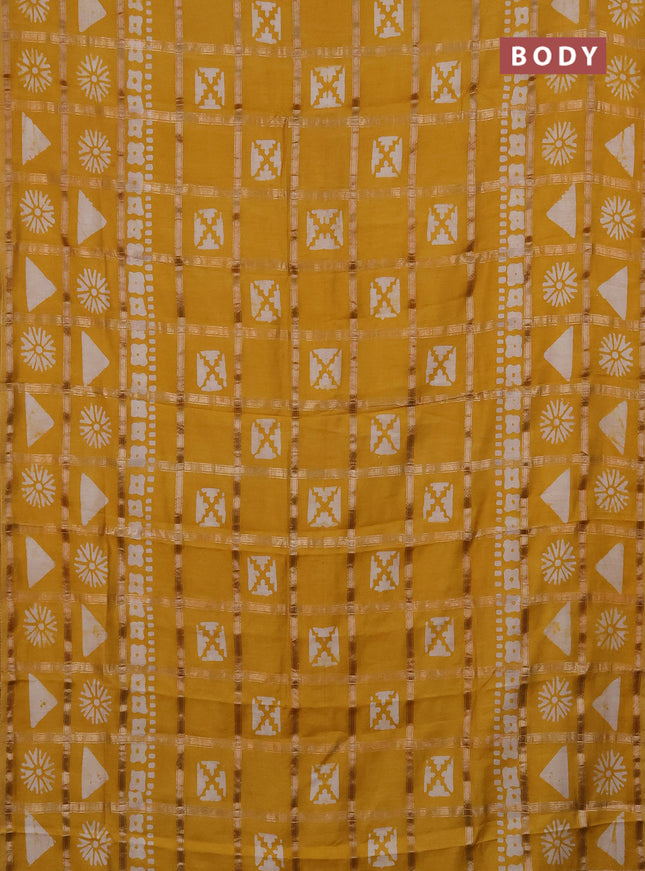 Semi chanderi saree mustard yellow with allover zari checks & batik prints in borderless style