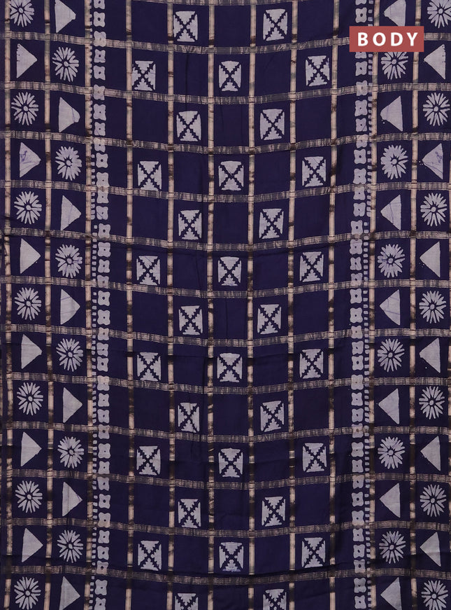 Semi chanderi saree navy blue with allover zari checks & batik prints in borderless style