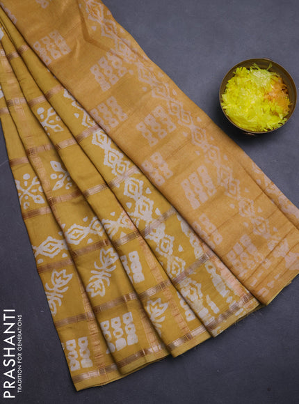 Semi chanderi saree mustard with allover zari checks & batik prints in borderless style