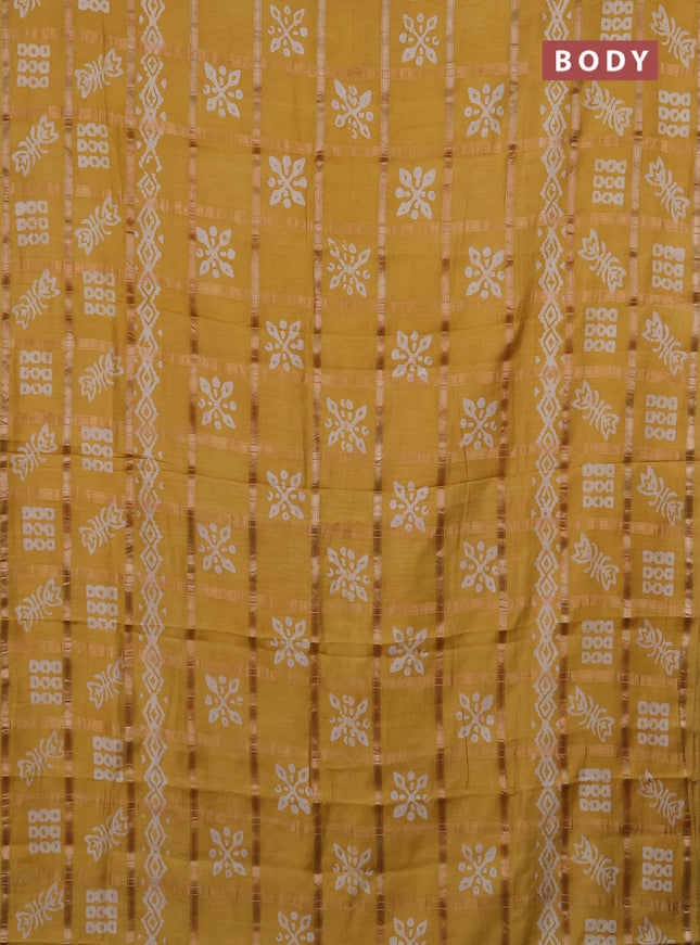 Semi chanderi saree mustard with allover zari checks & batik prints in borderless style