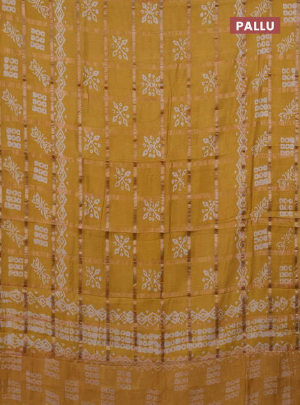 Semi chanderi saree mustard with allover zari checks & batik prints in borderless style