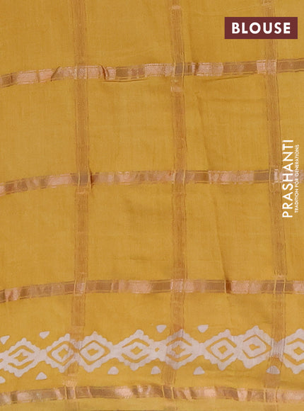 Semi chanderi saree mustard with allover zari checks & batik prints in borderless style