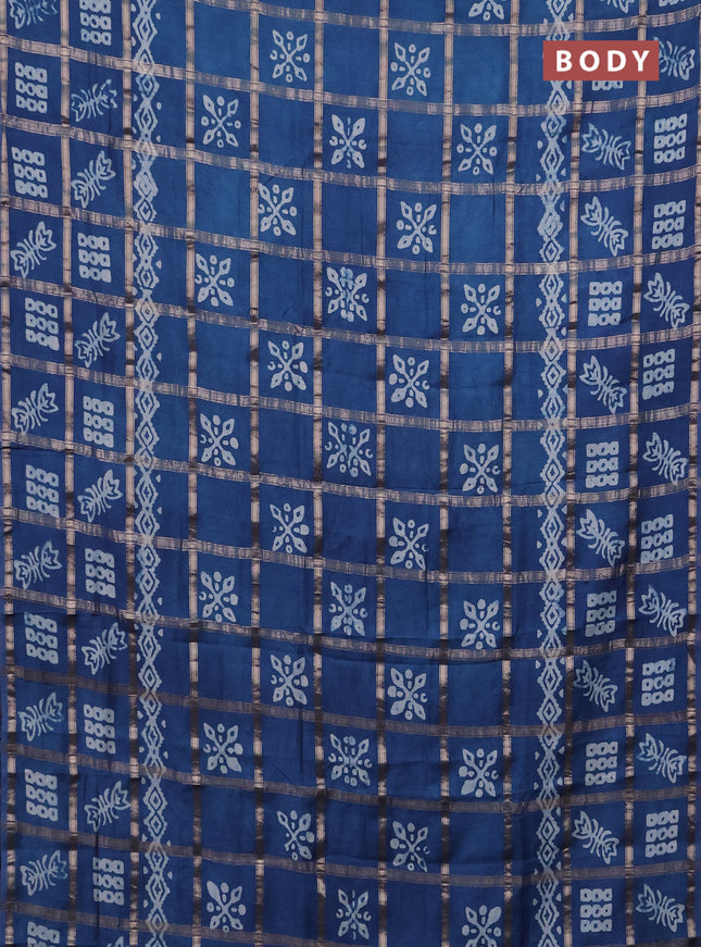 Semi chanderi saree peacock blue with allover zari checks & batik prints in borderless style
