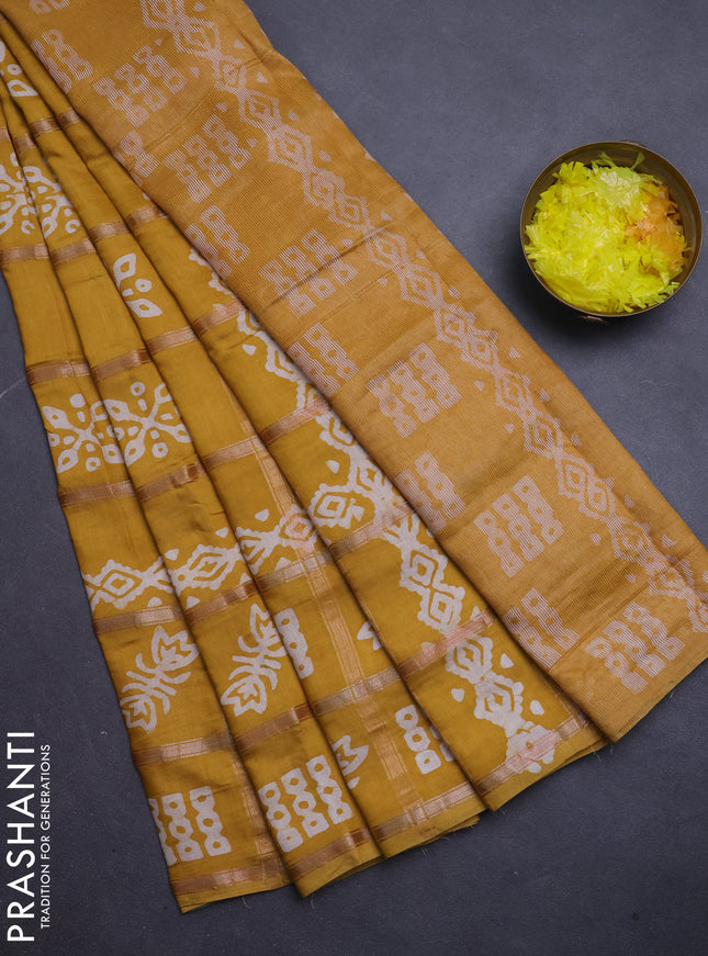 Semi chanderi saree mustard yellow with allover zari checks & batik prints in borderless style