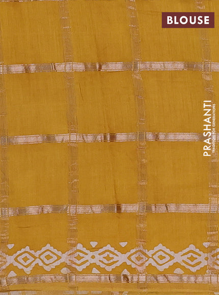 Semi chanderi saree mustard yellow with allover zari checks & batik prints in borderless style