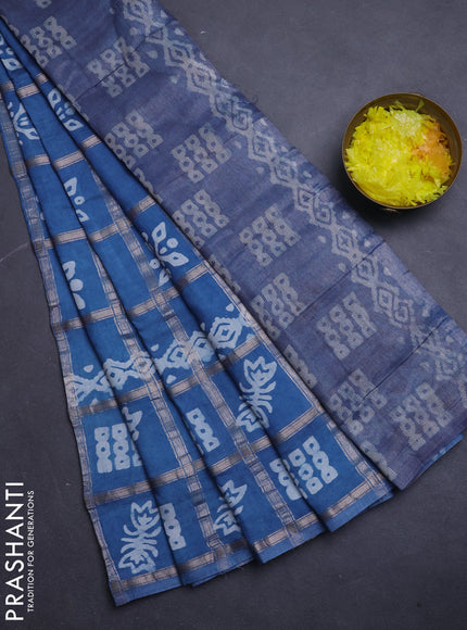 Semi chanderi saree blue shade with allover zari checks & batik prints in borderless style