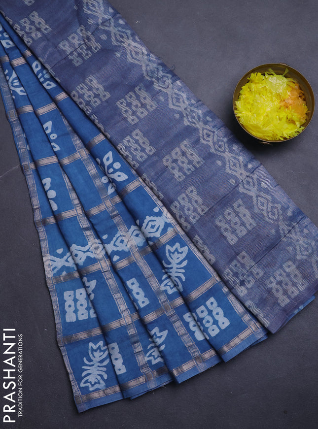 Semi chanderi saree blue shade with allover zari checks & batik prints in borderless style