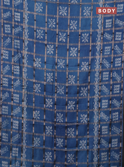 Semi chanderi saree blue shade with allover zari checks & batik prints in borderless style