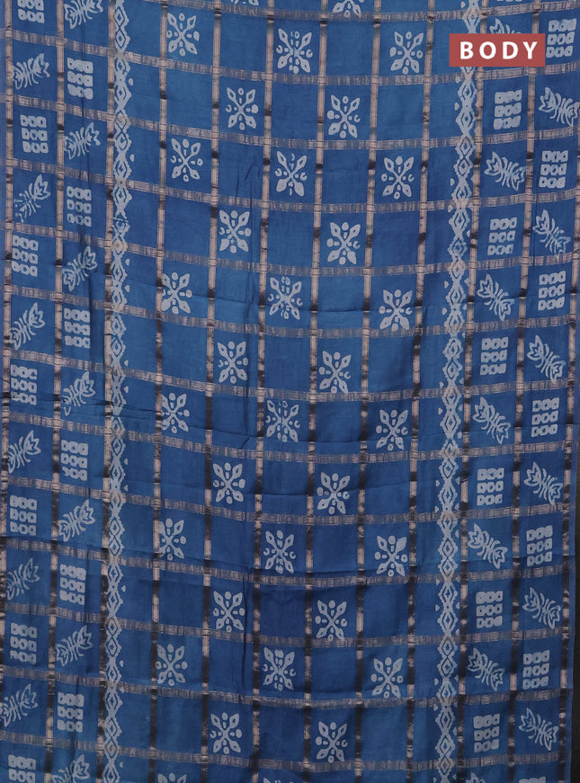 Semi chanderi saree blue shade with allover zari checks & batik prints in borderless style