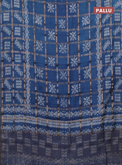 Semi chanderi saree blue shade with allover zari checks & batik prints in borderless style