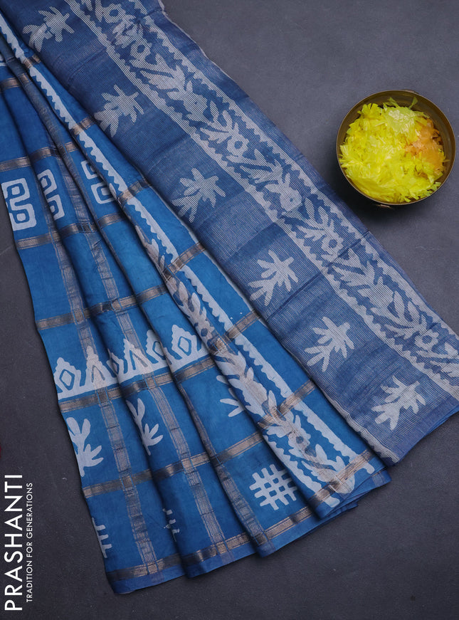 Semi chanderi saree blue with allover zari checks & batik prints in borderless style