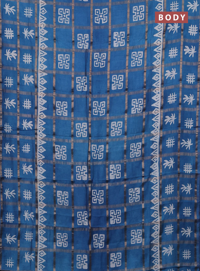 Semi chanderi saree blue with allover zari checks & batik prints in borderless style