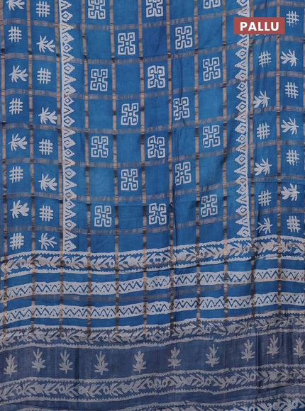 Semi chanderi saree blue with allover zari checks & batik prints in borderless style