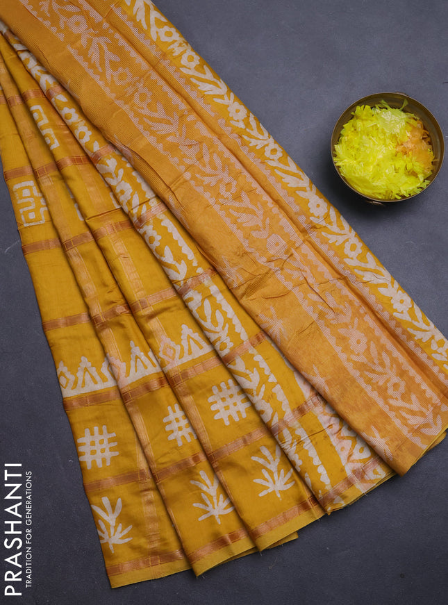 Semi chanderi saree mustard yellow with allover zari checks & batik prints in borderless style