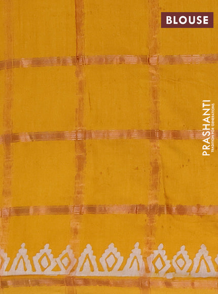 Semi chanderi saree mustard yellow with allover zari checks & batik prints in borderless style
