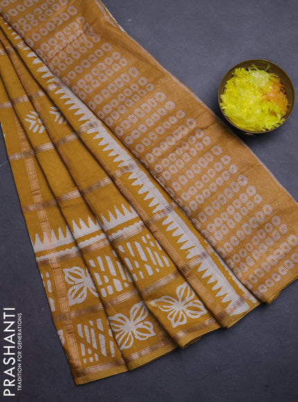 Semi chanderi saree mustard yellow and off white with allover zari checks & batik prints and batik printed border