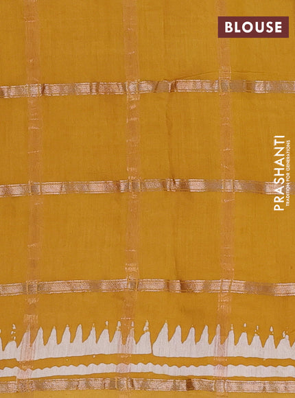 Semi chanderi saree mustard yellow and off white with allover zari checks & batik prints and batik printed border