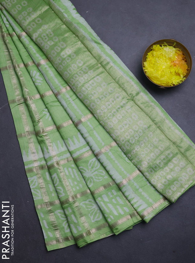 Semi chanderi saree pista green and off white with allover zari checks & batik prints and batik printed border