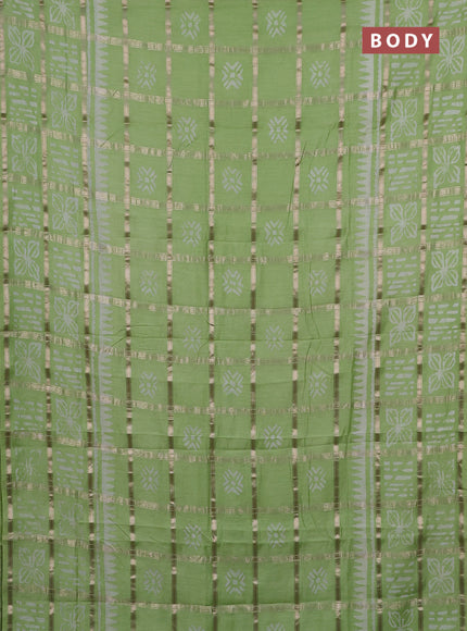 Semi chanderi saree pista green and off white with allover zari checks & batik prints and batik printed border