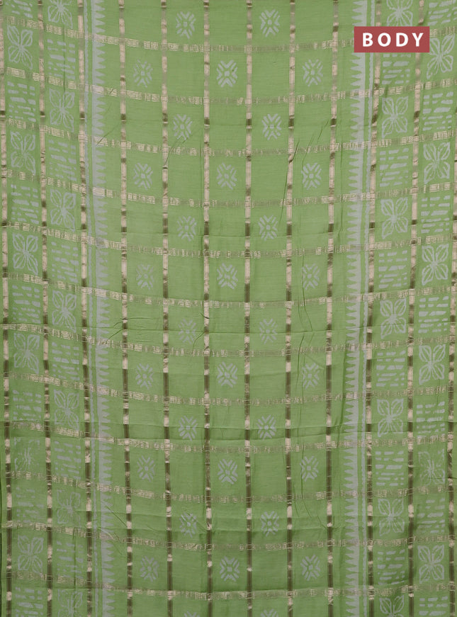 Semi chanderi saree pista green and off white with allover zari checks & batik prints and batik printed border